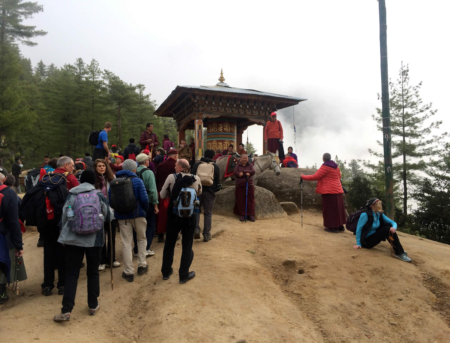Rinpoche and hikers resting at the half-way point to Taktsang.