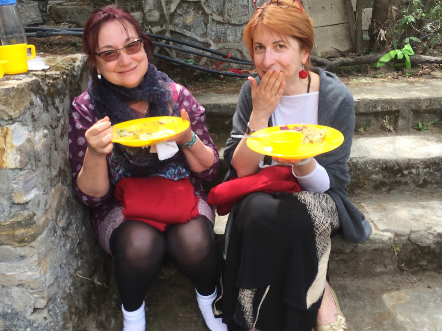 Mila Ridout and Seda Rafilovich enjoy lunch outside the lhakhang.