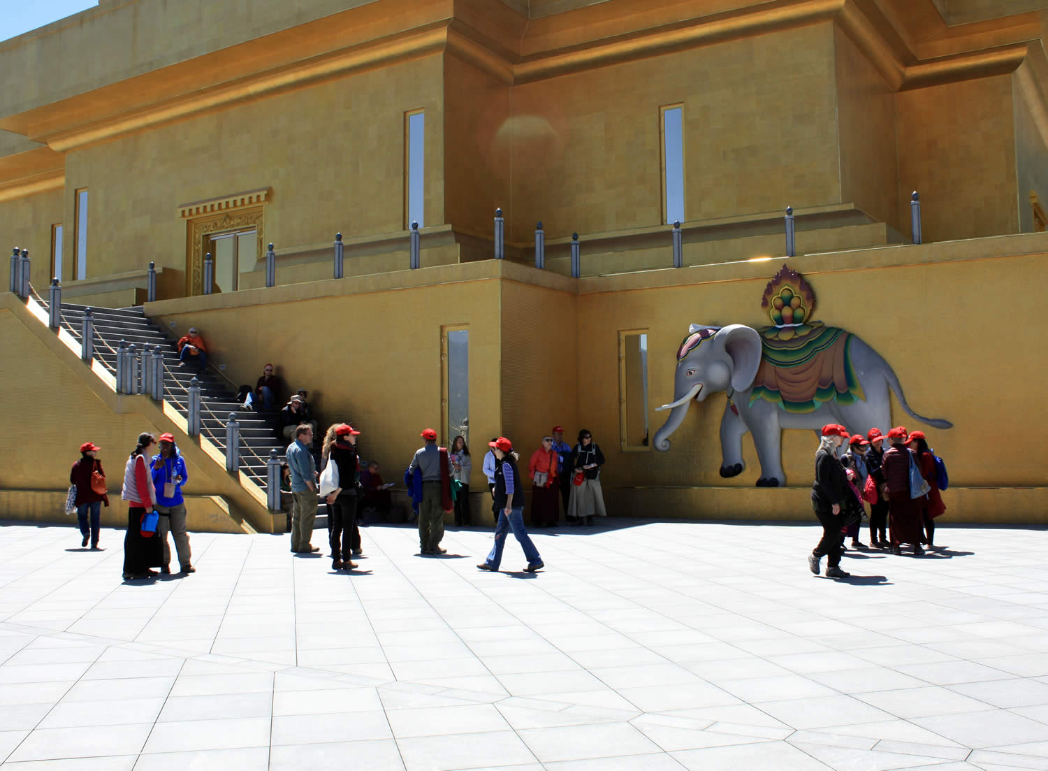 Group members admire the magnificent artwork on the exterior of the Buddha Dodenma shrine—here the 'precious elephant' from the mandala offering.